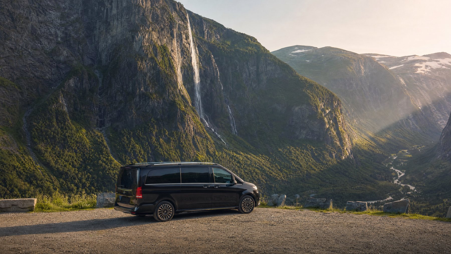 Mercedes V-Class at a waterfall valley viewpoint in the Swiss Alps